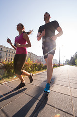 Image showing young couple jogging  in the city