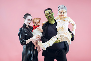 Image showing Halloween Family. Happy Father, Mother and Children Girls in Halloween Costume and Makeup