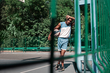 Image showing Picture of young resting african basketball player