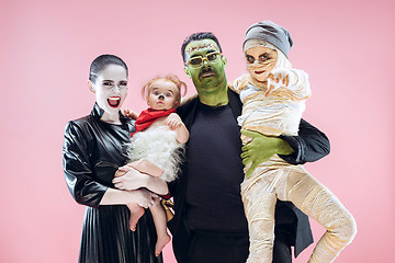 Image showing Halloween Family. Happy Father, Mother and Children Girls in Halloween Costume and Makeup