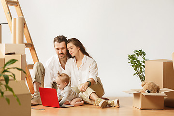 Image showing Couple moving to a new home - Happy married people buy a new apartment to start new life together