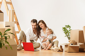 Image showing Couple moving to a new home - Happy married people buy a new apartment to start new life together