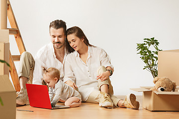 Image showing Couple moving to a new home - Happy married people buy a new apartment to start new life together