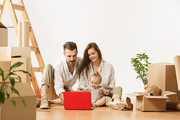 Image showing Couple moving to a new home - Happy married people buy a new apartment to start new life together