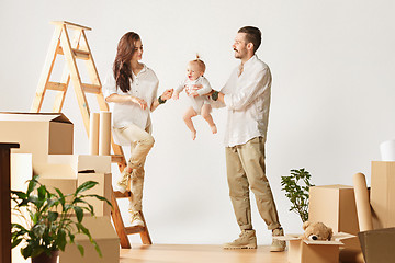 Image showing Couple moving to a new home - Happy married people buy a new apartment to start new life together