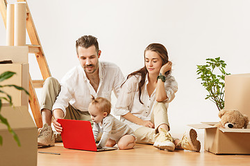 Image showing Couple moving to a new home - Happy married people buy a new apartment to start new life together