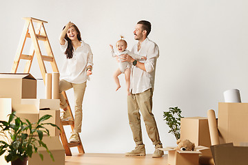 Image showing Couple moving to a new home - Happy married people buy a new apartment to start new life together