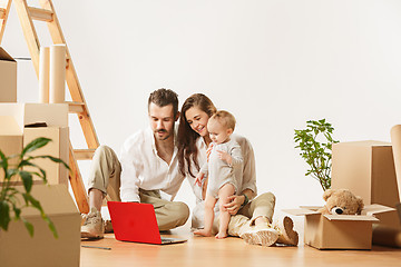 Image showing Couple moving to a new home - Happy married people buy a new apartment to start new life together