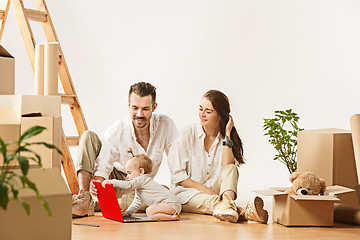 Image showing Couple moving to a new home - Happy married people buy a new apartment to start new life together