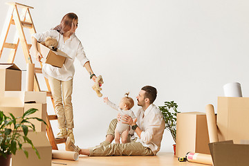 Image showing Couple moving to a new home - Happy married people buy a new apartment to start new life together