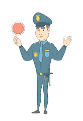 Image showing Caucasian traffic policeman holding traffic sign.