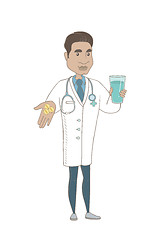 Image showing Young pharmacist giving pills and glass of water.