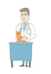 Image showing Young caucasian veterinarian examining cat.