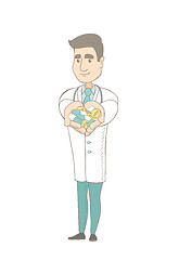 Image showing Young caucasian pharmacist giving pills.