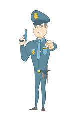 Image showing Young caucasian policeman holding a handgun.