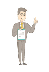 Image showing Young businessman showing clipboard and thumb up.