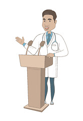 Image showing Hispanic doctor giving a speech from tribune.