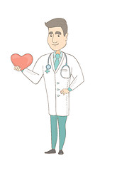 Image showing Caucasian cardiologist holding a big red heart.