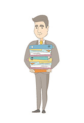 Image showing Caucasian office worker holding pile of folders.