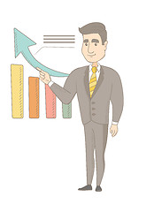 Image showing Young caucasian businessman pointing at chart.