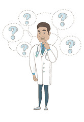 Image showing Thinking hispanic doctor with question marks.