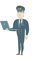 Image showing Young caucasian pilot using a laptop.