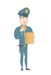 Image showing Young caucasian police officer eating hamburger.