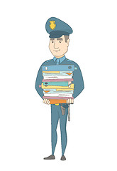 Image showing Young caucasian policeman holding pile of folders.