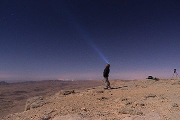 Image showing Light beam into the night desert
