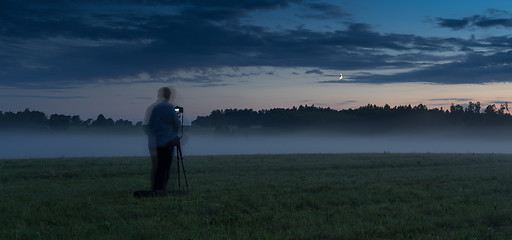 Image showing Photographer in a fog field