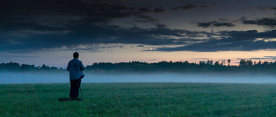 Image showing Photographer in a fog field
