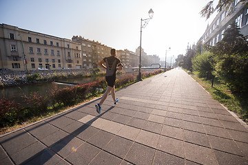 Image showing man jogging at sunny morning