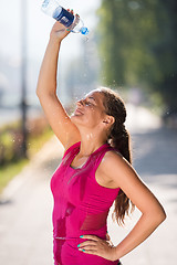 Image showing woman pouring water from bottle on her head