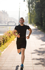 Image showing man jogging at sunny morning