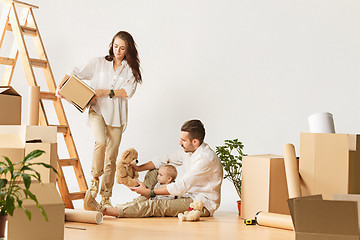 Image showing Couple moving to a new home - Happy married people buy a new apartment to start new life together