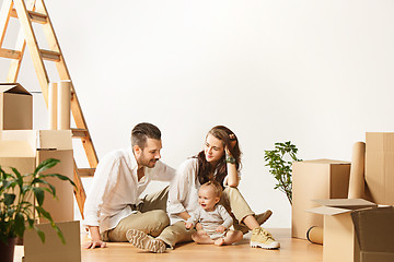 Image showing Couple moving to a new home - Happy married people buy a new apartment to start new life together