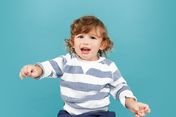 Image showing Portrait of happy joyful beautiful little boy, studio shot