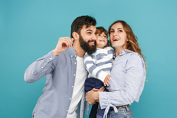 Image showing A happy family on blue background