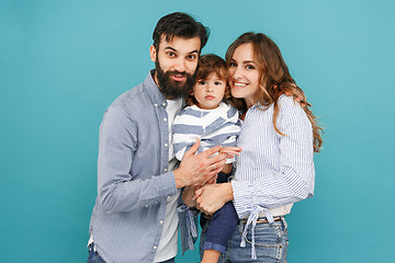 Image showing A happy family on blue background