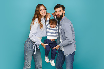 Image showing A happy family on blue background