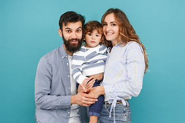 Image showing A happy family on blue background