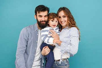 Image showing A happy family on blue background