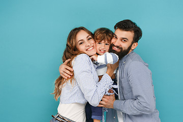 Image showing A happy family on blue background