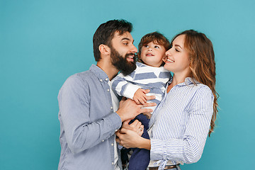 Image showing A happy family on blue background