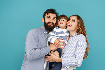 Image showing A happy family on blue background