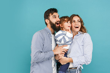 Image showing A happy family on blue background