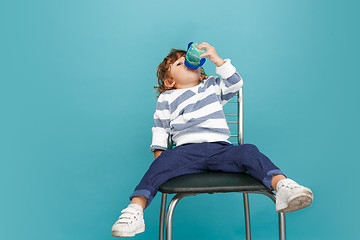 Image showing Portrait of happy joyful beautiful little boy, studio shot