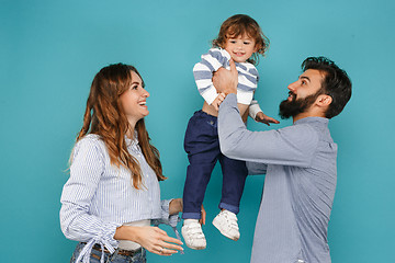 Image showing A happy family on blue background