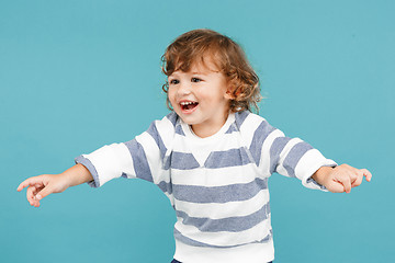 Image showing Portrait of happy joyful beautiful little boy, studio shot