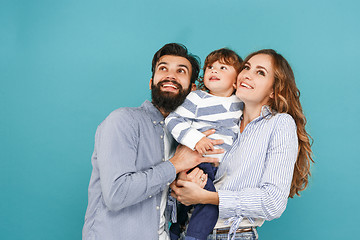 Image showing A happy family on blue background